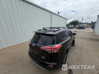 Czwarte zdjęcie samochodu z boku: 2016 TOYOTA RAV4 HV XLE VIN:JTMRJREV9GD040528 - miniatura