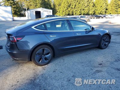 Trzecie zdjęcie samochodu z tyłu: 2018 TESLA MODEL 3 VIN:5YJ3E1EB0JF129180 - miniatura