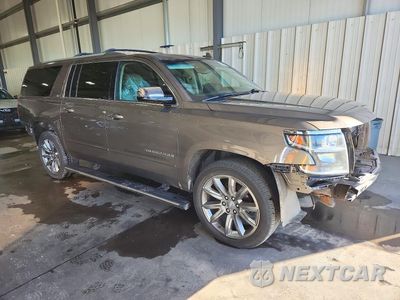 Czwarte zdjęcie samochodu z boku: 2016 CHEVROLET SUBURBAN K1500 LTZ VIN:1GNSKJKC1GR356809 - miniatura