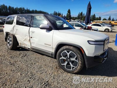 Czwarte zdjęcie samochodu z boku: 2023 RIVIAN R1S ADVENTURE VIN:7PDSGABA1PN017640 - miniatura