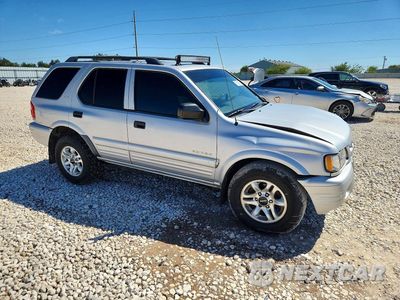 Czwarte zdjęcie samochodu z boku: 2002 ISUZU RODEO S VIN:4S2CK58WX24316552 - miniatura
