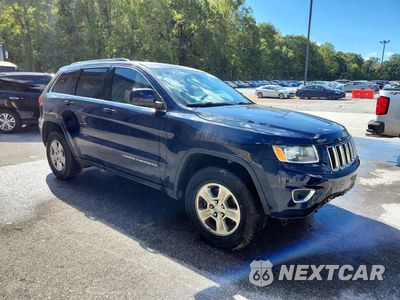 Czwarte zdjęcie samochodu z boku: 2016 JEEP GRAND CHEROKEE LAREDO VIN:1C4RJFAG2GC505307 - miniatura