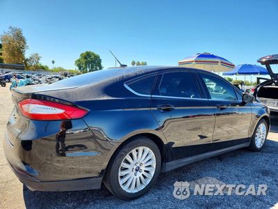 Trzecie zdjęcie samochodu z tyłu: 2016 FORD FUSION S HYBRID VIN:3FA6P0UU4GR346250 - miniatura