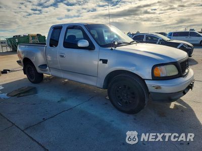 Czwarte zdjęcie samochodu z boku: 2002 FORD F150 VIN:2FTRX07L02CA81080 - miniatura