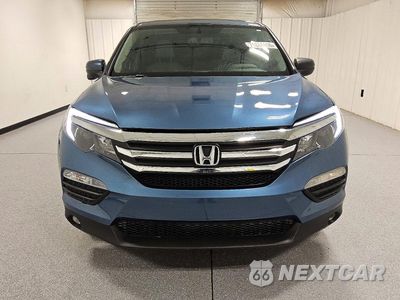 Piąte zdjęcie samochodu w środku: 2017 HONDA PILOT EXL VIN:5FNYF6H58HB101644 - miniatura
