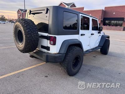 Czwarte zdjęcie samochodu z boku: 2014 JEEP WRANGLER UNLIMITED SPORT VIN:1C4BJWDG6EL105261 - miniatura