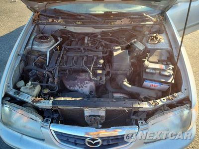 Zdjęcie 11 z 12 samochodu: 2001 MAZDA 626 ES VIN:1YVGF22C115225865 - miniatura