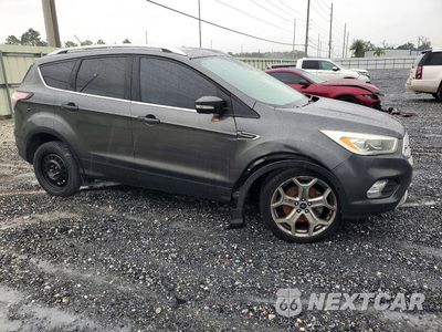 Czwarte zdjęcie samochodu z boku: 2017 FORD ESCAPE TITANIUM VIN:1FMCU0J97HUB36575 - miniatura