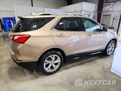 Trzecie zdjęcie samochodu z tyłu: 2018 CHEVROLET EQUINOX PREMIER VIN:2GNAXMEV6J6267932 - miniatura