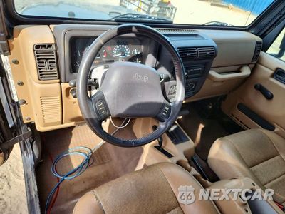 Zdjęcie 8 z 12 samochodu: 1999 JEEP WRANGLER / TJ SPORT VIN:1J4FY19S4XP401575 - miniatura