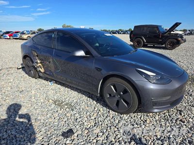 Czwarte zdjęcie samochodu z boku: 2023 TESLA MODEL 3 VIN:5YJ3E1EA9PF428845 - miniatura