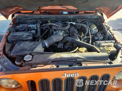 Zdjęcie 12 z 13 samochodu: 2011 JEEP WRANGLER UNLIMITED SAHARA VIN:1J4BA5H13BL604184 - miniatura