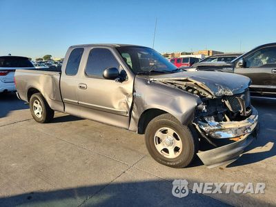 Czwarte zdjęcie samochodu z boku: 2002 FORD F150 VIN:1FTRX17252NC08199 - miniatura