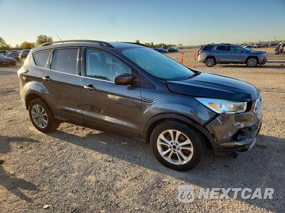Czwarte zdjęcie samochodu z boku: 2017 FORD ESCAPE SE VIN:1FMCU9GDXHUA96881 - miniatura