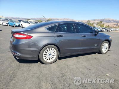 Trzecie zdjęcie samochodu z tyłu: 2016 FORD FUSION SE PHEV VIN:3FA6P0PU6GR357150 - miniatura