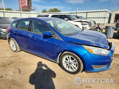 Czwarte zdjęcie samochodu z boku: 2018 FORD FOCUS SE VIN:1FADP3K22JL223420 - miniatura