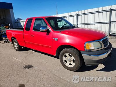 Czwarte zdjęcie samochodu z boku: 2002 FORD F-150 VIN:1FTRX17W32NB99490 - miniatura