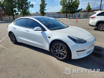 Czwarte zdjęcie samochodu z boku: 2021 TESLA MODEL 3 VIN:5YJ3E1EA7MF876965 - miniatura