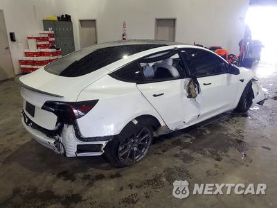 Trzecie zdjęcie samochodu z tyłu: 2023 TESLA MODEL 3 VIN:5YJ3E1EA7PF671344 - miniatura