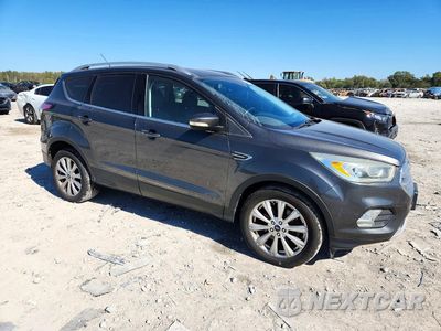 Czwarte zdjęcie samochodu z boku: 2017 FORD ESCAPE TITANIUM VIN:1FMCU9JD5HUD66205 - miniatura