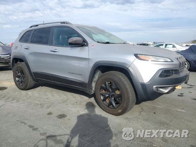 Czwarte zdjęcie samochodu z boku: 2016 JEEP CHEROKEE TRAILHAWK VIN:1C4PJMBSXGW133325 - miniatura