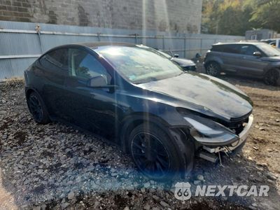 Czwarte zdjęcie samochodu z boku: 2023 TESLA MODEL Y VIN:7SAYGAEE2PF921238 - miniatura