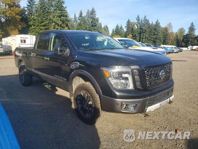 Czwarte zdjęcie samochodu z boku: 2017 NISSAN TITAN XD PRO-4X VIN:1N6BA1F41HN568047 - miniatura