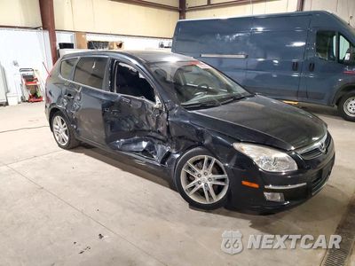 Czwarte zdjęcie samochodu z boku: 2009 HYUNDAI ELANTRA TOURING VIN:KMHDC86E59U032048 - miniatura