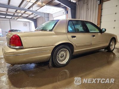 Trzecie zdjęcie samochodu z tyłu: 1999 FORD CROWN VICTORIA LX VIN:2FAFP74W4XX236665 - miniatura