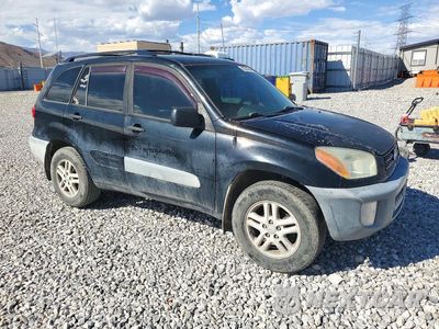 Czwarte zdjęcie samochodu z boku: 2001 TOYOTA RAV4 BASE VIN:JTEHH20V110082031 - miniatura