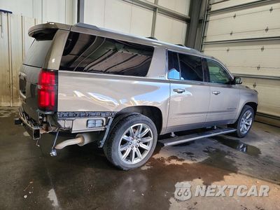 Trzecie zdjęcie samochodu z tyłu: 2016 CHEVROLET SUBURBAN K1500 LTZ VIN:1GNSKJKC1GR356809 - miniatura