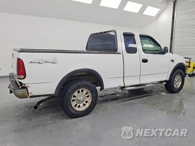 Trzecie zdjęcie samochodu z tyłu: 2003 FORD F150 VIN:1FTRX18L33NB21913 - miniatura