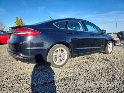 Trzecie zdjęcie samochodu z tyłu: 2018 FORD FUSION SE HYBRID VIN:3FA6P0LU0JR170225 - miniatura