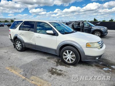 Czwarte zdjęcie samochodu z boku: 2009 FORD TAURUS X SEL VIN:1FMDK02W29GA06248 - miniatura