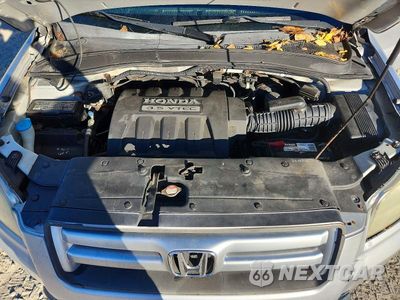 Zdjęcie 12 z 14 samochodu: 2006 HONDA PILOT EX VIN:2HKYF18426H526186 - miniatura