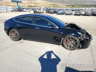 Czwarte zdjęcie samochodu z boku: 2018 TESLA MODEL 3 VIN:5YJ3E1EB1JF072505 - miniatura