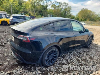 Trzecie zdjęcie samochodu z tyłu: 2023 TESLA MODEL Y VIN:7SAYGAEE2PF921238 - miniatura