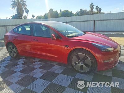Czwarte zdjęcie samochodu z boku: 2022 TESLA MODEL 3 VIN:5YJ3E1EA5NF184799 - miniatura