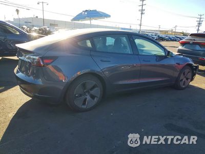 Trzecie zdjęcie samochodu z tyłu: 2023 TESLA MODEL 3 VIN:5YJ3E1EA7PF501999 - miniatura