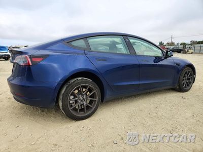 Trzecie zdjęcie samochodu z tyłu: 2023 TESLA MODEL 3 VIN:5YJ3E1EA7PF714483 - miniatura