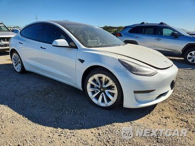 Czwarte zdjęcie samochodu z boku: 2022 TESLA MODEL 3 VIN:5YJ3E1EB0NF143585 - miniatura