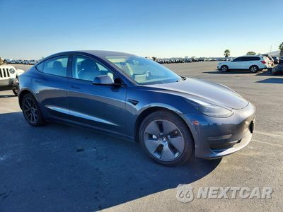 Czwarte zdjęcie samochodu z boku: 2023 TESLA MODEL 3 VIN:5YJ3E1EA5PF618030 - miniatura