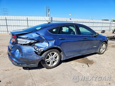 Trzecie zdjęcie samochodu z tyłu: 2018 FORD FUSION SE HYBRID VIN:3FA6P0LU3JR101724 - miniatura