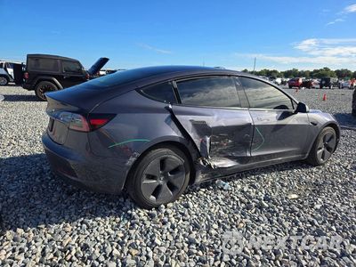 Trzecie zdjęcie samochodu z tyłu: 2023 TESLA MODEL 3 VIN:5YJ3E1EA9PF428845 - miniatura