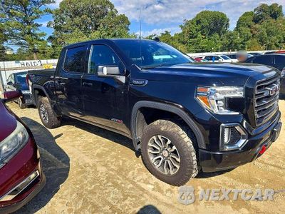 Czwarte zdjęcie samochodu z boku: 2021 GMC SIERRA K1500 AT4 VIN:3GTP9EED7MG278988 - miniatura