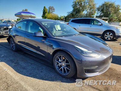 Czwarte zdjęcie samochodu z boku: 2023 TESLA MODEL 3 VIN:5YJ3E1EA5PF434092 - miniatura