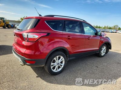 Trzecie zdjęcie samochodu z tyłu: 2018 FORD ESCAPE SEL VIN:1FMCU9HD2JUC39889 - miniatura