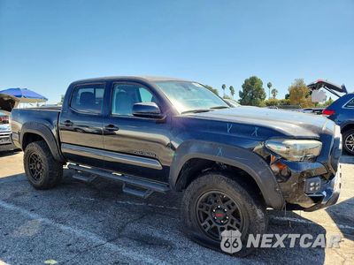 Czwarte zdjęcie samochodu z boku: 2019 TOYOTA TACOMA SR5 VIN:5TFAX5GN5KX135449 - miniatura