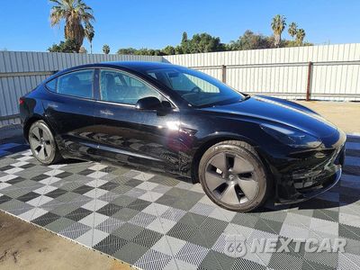Czwarte zdjęcie samochodu z boku: 2023 TESLA MODEL 3 VIN:5YJ3E1EA9PF458671 - miniatura