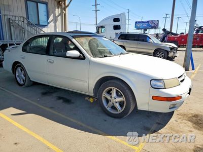 Czwarte zdjęcie samochodu z boku: 1999 NISSAN MAXIMA GXE VIN:JN1CA21D2XT204284 - miniatura